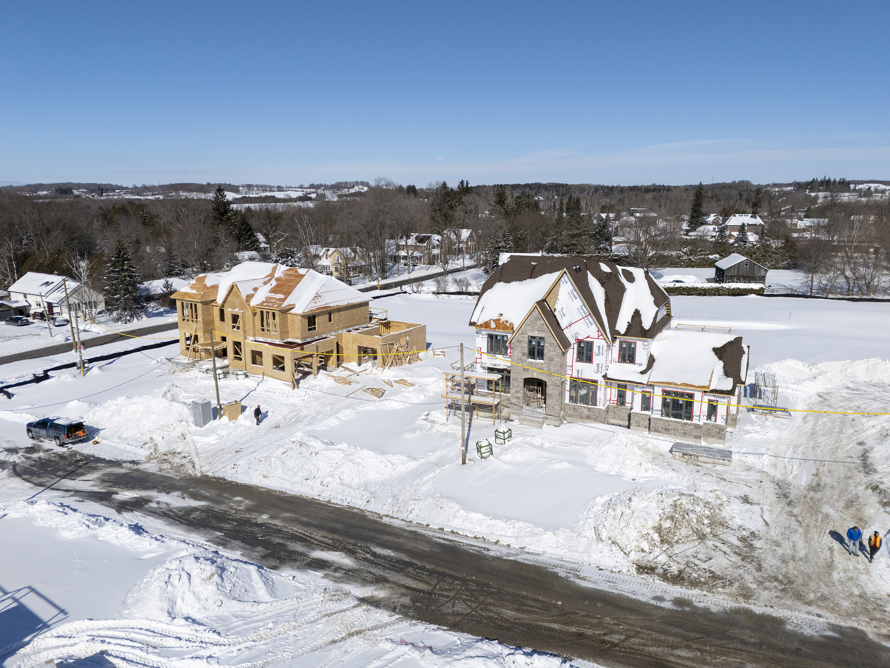 Lot 1 - Framing with roof sheathed and lot 2 - Masonry completed